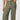 Person wearing olive green pants on a white background